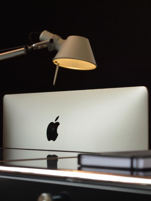 Desk lamp above an open laptop