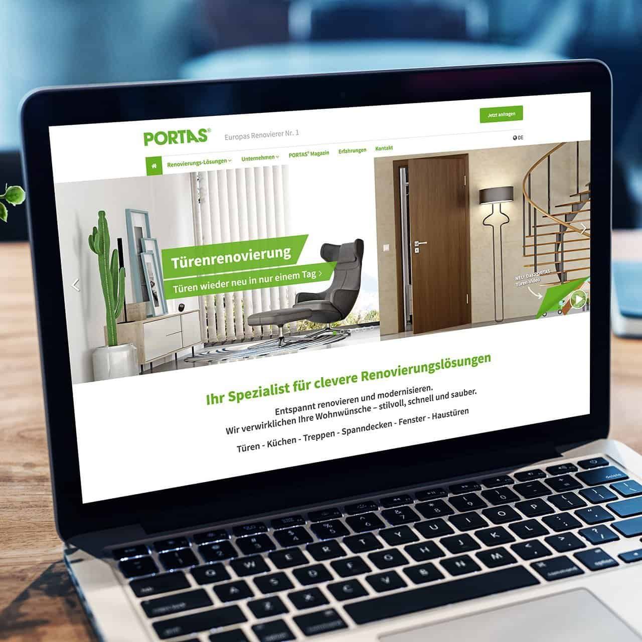 Laptop showing the PORTAS home page: door renovation, with all renovation solutions from doors to front doors below